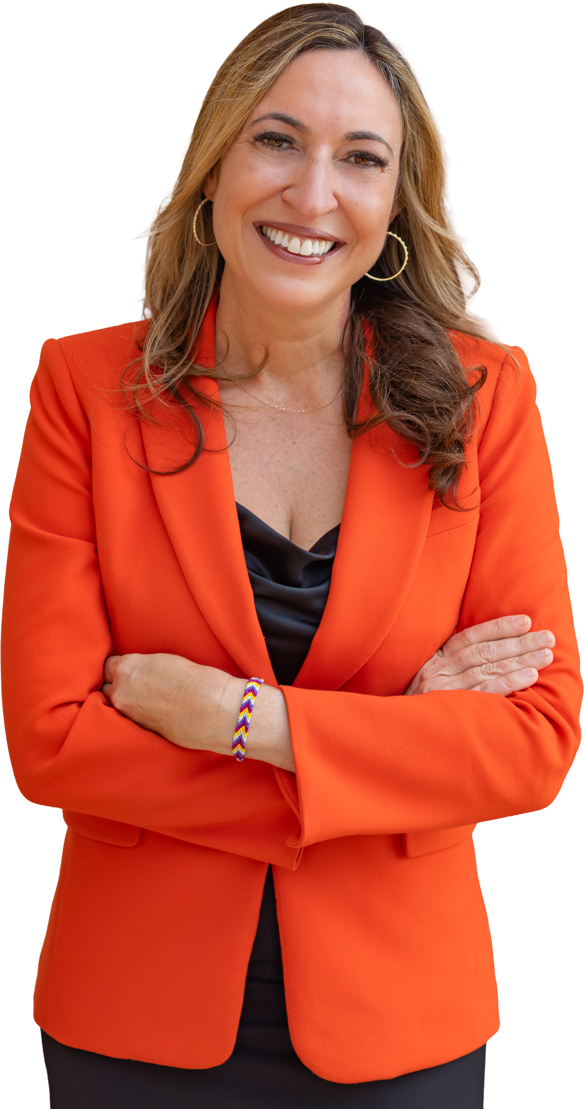 Dr. Emily Triana Marx smiling, arms crossed, wearing an orange blazer